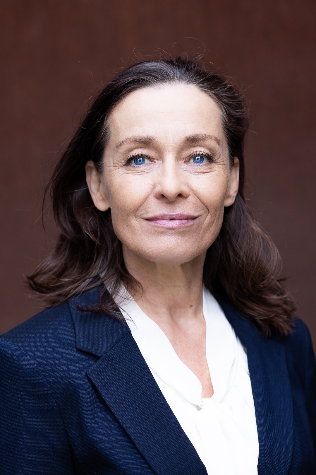 Sichtbar sympathisches Portrait einer Unternehmerin. Portrait Personal Fashion Shooting, Sedcardshooting München